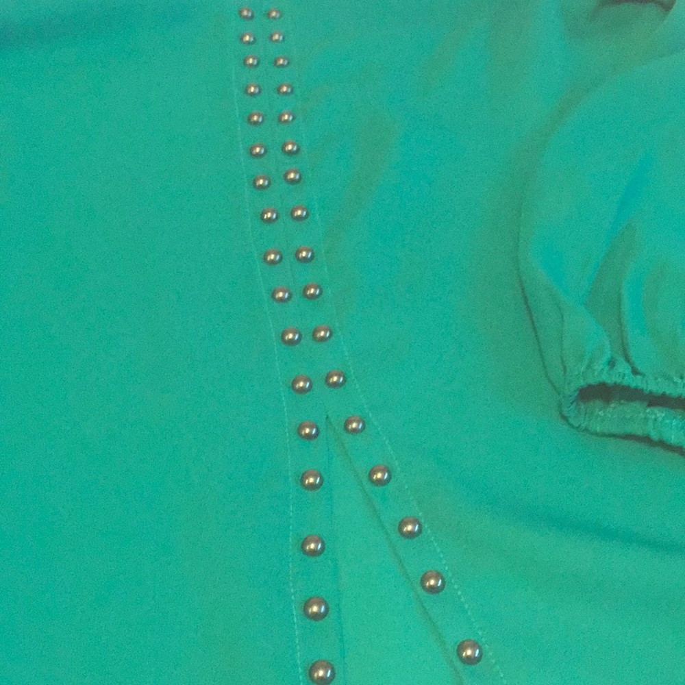 Teal blouse with stud detail down back.